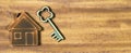 Real estate, new own home honcept, key and wooden house, web banner Royalty Free Stock Photo