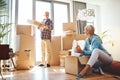 Real estate, property and a senior couple moving house while packing boxes together in their home. Box, investment and Royalty Free Stock Photo