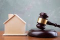 Real estate sale auction concept - gavel and house model on the wooden table Royalty Free Stock Photo