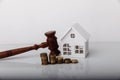 Real estate sale auction concept. Wooden gavel and house model Royalty Free Stock Photo