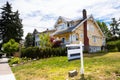 Real Estate Sale Sign along a Street