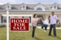 Real Estate Sign and Hispanic Family in Front of House Royalty Free Stock Photo