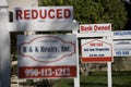 Real Estate Signs at Foreclosed Property