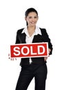 Real estate woman holding a sold sign Royalty Free Stock Photo