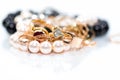 Real gold jewlery, diamonds, gems, rings, neckless with pearls close up shot Royalty Free Stock Photo