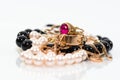 Real gold jewlery, diamonds, gems, rings, neckless with pearls close up shot Royalty Free Stock Photo