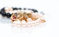 Real gold jewlery, diamonds, gems, rings, neckless with pearls close up shot Royalty Free Stock Photo