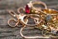 Real gold rings with diamond on weathered pine wood board close up macro shot Royalty Free Stock Photo