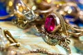 Real gold rings with diamonds, gems, neckless close up macro shot Royalty Free Stock Photo