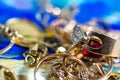 Real gold rings with diamonds, gems, neckless close up macro shot Royalty Free Stock Photo