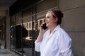 Real Happy 20s Plus Size Pretty Girl Talking on Phone. Smiling Young Caucasian Woman Royalty Free Stock Photo