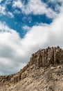 Real Heart shaped cloud in the sky above the high rocky mountains