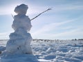 Real icy snowman in winter landscape Royalty Free Stock Photo