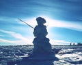 Real icy snowman in winter landscape Royalty Free Stock Photo