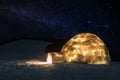 Real igloo under starry sky