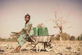 Real Indigenous Youngster Saving Healthy Water in a village Royalty Free Stock Photo