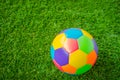 Real leather Colorful multi colour Soccer ball on green grass . Royalty Free Stock Photo