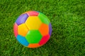 Real leather Colorful multi colour Soccer ball on green grass . Royalty Free Stock Photo