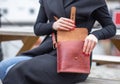 Real leather handbag opened in brown with model