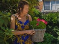 Real life of province in the summer. Woman in her garden. Royalty Free Stock Photo