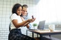 Real love!. Young man showing an engagement ring diamond to his amazed girlfriend in Home Office Royalty Free Stock Photo