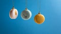 Real macaron cookies as Xmas balls hanging on golden ribbon. Christmas arrangement on blue background