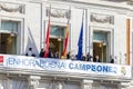 Real Madrid celebration in the Puerta del Sol building in Madrid. Square full of people watching the club players.