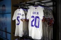 Real Madrid kit in the fan shop. Club store with team shirts.