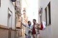 Real marriage of gay couple, walking down the street, hands full of shopping bags, happy and funny. Concept lgtb, lgtbiq+, couples Royalty Free Stock Photo