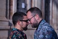 Real marriage portrait of gay couple, hugging, eyes closed and foreheads glued together. Concept lgtb, lgtbiq+, couples, in love, Royalty Free Stock Photo