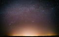 Real Night Sky Stars Background With Natural Colourful Sky Gradient. Sunset, Sunrise Light And Starry Sky. Yellow And Royalty Free Stock Photo