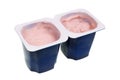 Real nonfat cherry yogurt in blue open plastic cups isolated macro