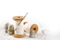 real old reels spoons treads with needle and thimble on white wooden table Royalty Free Stock Photo