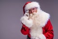 Real old Santa Claus looking at the camera, posing on a studio background. Merry Christmas and Happy New Year! Copy space. Xmas Royalty Free Stock Photo