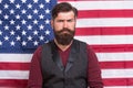 He is real patriot. serious american citizen in the election. celebration of victory. bearded hipster man being