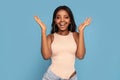 Beautiful smiling african american woman with glamour makeup and long dark hair looking at the camera Royalty Free Stock Photo