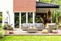 Real photo of a beautiful terrace with garden furniture, plants Royalty Free Stock Photo