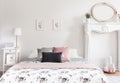 Real photo of bright feminine English style bedroom interior wit