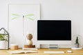 Real photo of a desk with a computer screen, lamp and ornaments Royalty Free Stock Photo