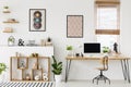 Real photo of a desk with a mockup computer screen, ornaments an Royalty Free Stock Photo