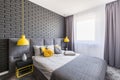 Real photo of grey and yellow bedroom interior with window with Royalty Free Stock Photo