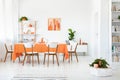 Real photo of white room interior with dining table Royalty Free Stock Photo