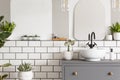 Real photo of a washbasin on a cupboard in a bathroom interior w Royalty Free Stock Photo