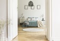 Real photo of white bedroom interior with round rug, king-size b