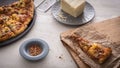 Real pizza from delivery on wooden table Royalty Free Stock Photo