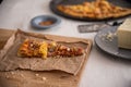 Real pizza from delivery on wooden table Royalty Free Stock Photo