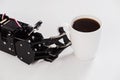 Real robot hand and white cup of coffee. Concept of robotic process automation
