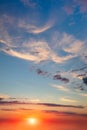 Real Sky - Background of Light cirrus clouds in the blue sky during dawn sunset with real sun. Without any birds Royalty Free Stock Photo