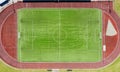 a real soccer field, football field. Green grass. green striped lawn. White markings on the grass, running track for athletics Royalty Free Stock Photo