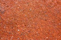 Real texture of small red stones as background Royalty Free Stock Photo
